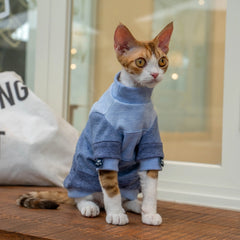 Soft breathable cotton fabric detail of a blue turtleneck sweatshirt specifically designed for hairless Sphynx cats to prevent skin irritation