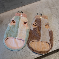 Detailed shot of the durable flower-shaped zipper pull and secure front-zip design on a winter cat fleece sweater